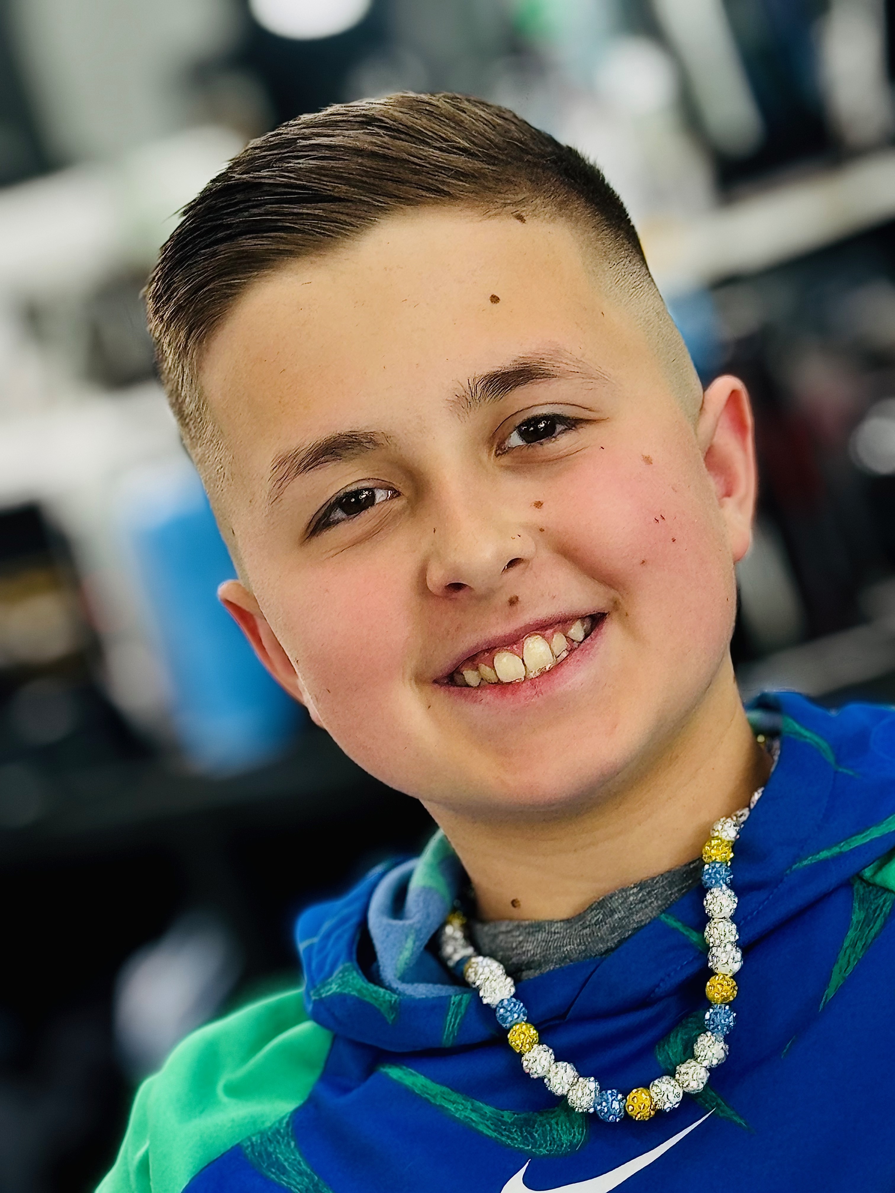 Child getting a haircut at Klass Cutz